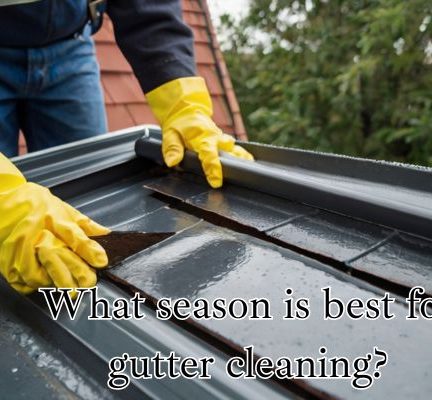 Manual gutter cleaning in progress.